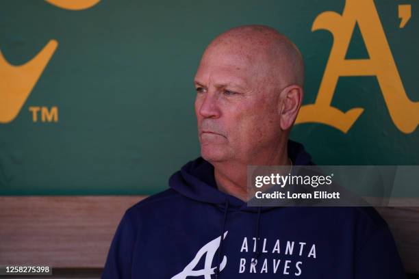 Manager Brian Snitker of the Atlanta Braves sits in the dugout before a game against the Oakland Athletics at RingCentral Coliseum on May 29, 2023 in...