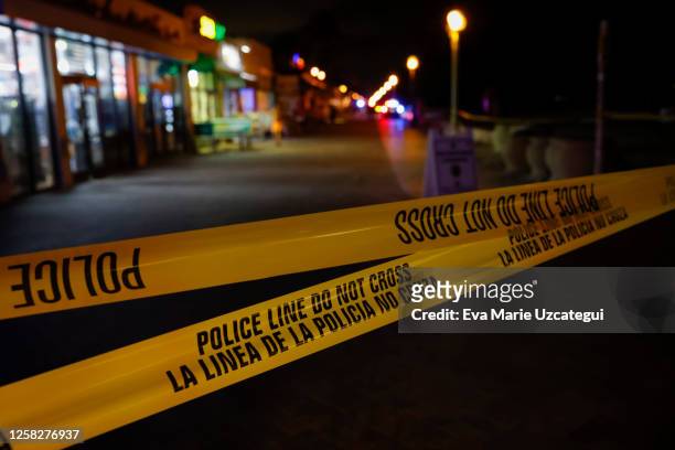 Crime scene tape cordon is seen on a street as law enforcement officers respond to a shooting at Hollywood Beach on May 29, 2023 in Hollywood,...