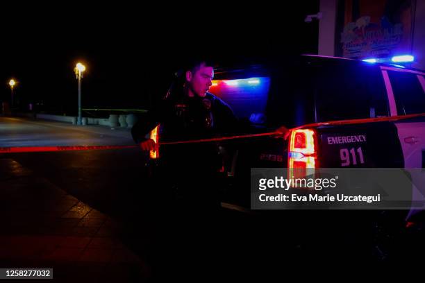 Law enforcement officer is seen on a crime scene as they respond to a shooting at Hollywood Beach on May 29, 2023 in Hollywood, Florida. At least...