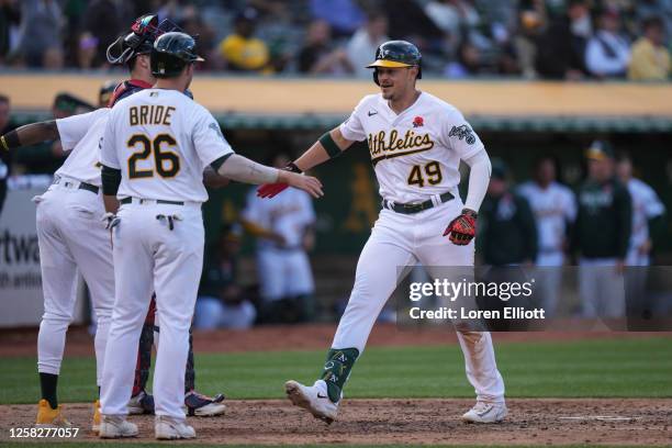 Ryan Noda of the Oakland Athletics celebrates his three-run home run in the fifth inning against the Atlanta Braves at RingCentral Coliseum on May...