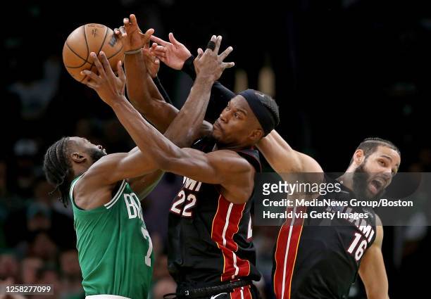 Jaylen Brown of the Boston Celtics, Jimmy Butler of the Miami Heat and Caleb Martin go after the ball during the second quarter of Game 7 of the NBA...