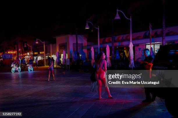 Beachgoers are seen next to a crime scene as law enforcement officers respond to a shooting at Hollywood Beach on May 29, 2023 in Hollywood, Florida....