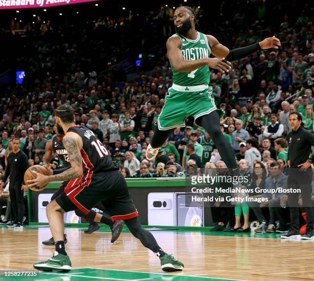 Caleb Martin of the Miami Heat gets away from Jaylen Brown of the Boston Celtics during the second half of Game 7 of the NBA Eastern Conference...