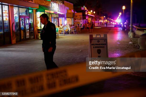 Law enforcement officer is seen on a crime scene as they respond to a shooting at Hollywood Beach on May 29, 2023 in Hollywood, Florida. At least...