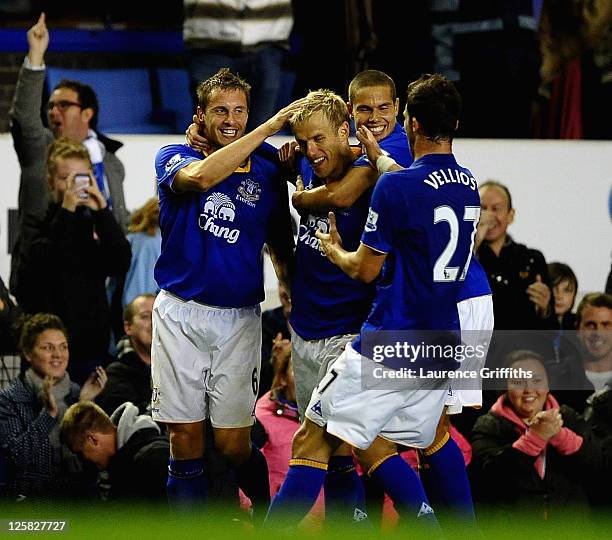 Phil Neville of Everton is congratulated by Phil Jagielka on scoring the second goal during the Carling Cup Third Round match between Everton and...