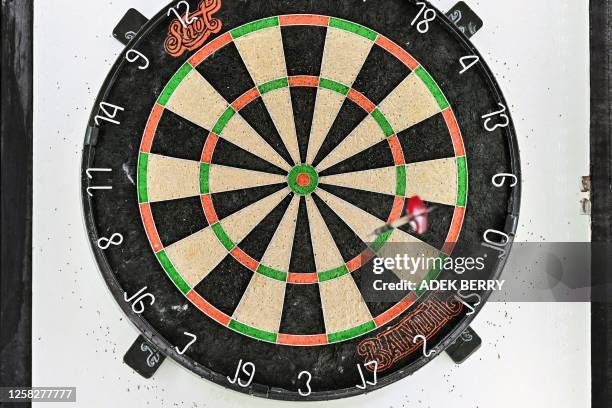 This picture taken on May 20, 2023 shows a dartboard during a dart competition in Port Moresby. At a smoky sports club in Papua New Guinea's...