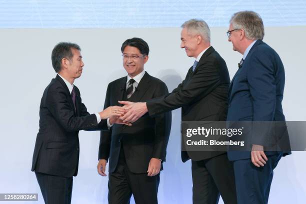 Satoshi Ogiso, chief executive officer of Hino Motors Ltd., from left, Koji Sato, president of Toyota Motor Corp., Karl Deppen, chief executive...