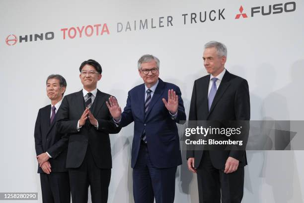 Satoshi Ogiso, chief executive officer of Hino Motors Ltd., from left, Koji Sato, president of Toyota Motor Corp., Martin Daum, chief executive...