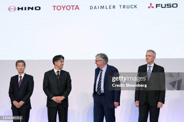 Satoshi Ogiso, chief executive officer of Hino Motors Ltd., from left, Koji Sato, president of Toyota Motor Corp., Martin Daum, chief executive...
