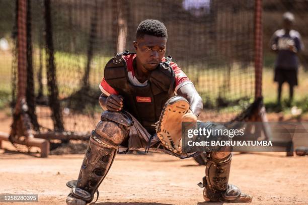 Ugandan baseball player Dennis Kasumba who dreams of becoming Uganda's first US Major League Baseball player trains with his teammates at Gayaza...