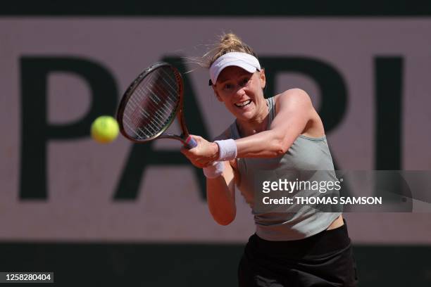Alison Riske plays a backhand return Russia's Mirra Andreeva during their women's singles match on day three of the Roland-Garros Open tennis...