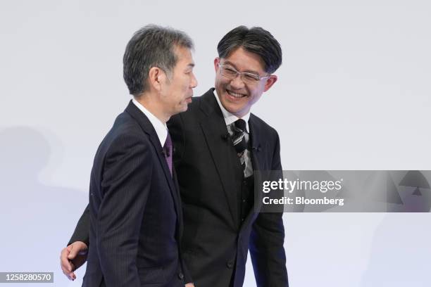 Satoshi Ogiso, chief executive officer of Hino Motors Ltd., left, Koji Sato, president of Toyota Motor Corp., attend a news conference in Tokyo,...