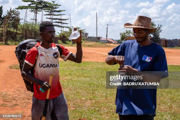 Ugandan baseball player Dennis Kasumba who dreams of becoming Uganda's first US Major League Baseball player and the coach John Bosco Sempa drink...