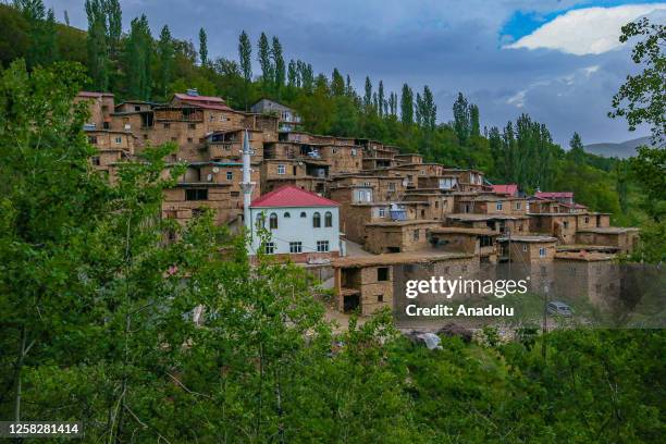 View of stone houses during spring season at Koclu village on the slopes of deep valleys in Hizan district of Bitlis, Turkiye on May 27, 2023. Stone...