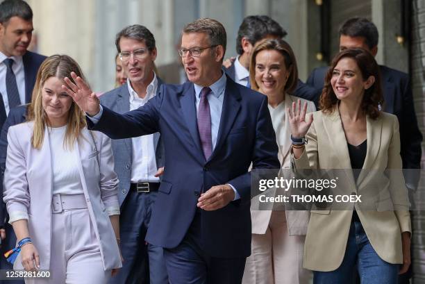 Partido Popular party's leader Alberto Nunez Feijoo arrives with Madrid regional president Isabel Diaz Ayuso and other party members to meet with...