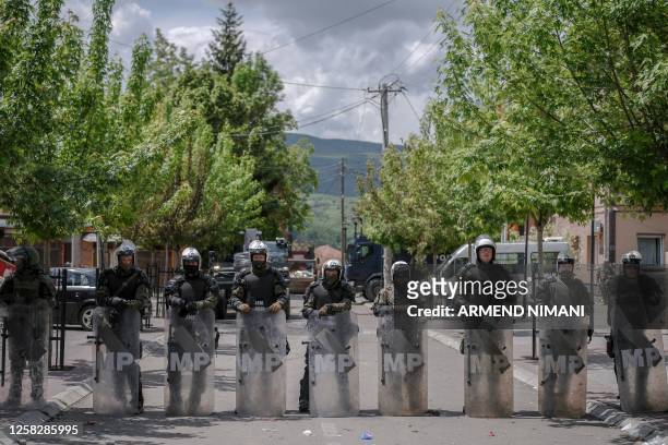 Soldiers and International military police secure the area near Zvecan, northern Kosovo on May 30 a day following clashes with Serb protesters...