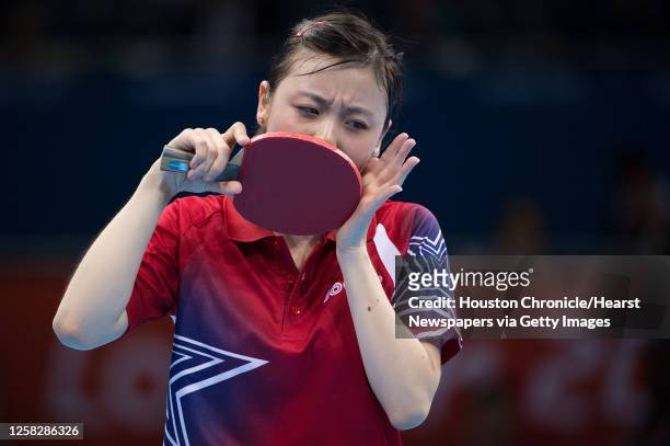 Ariel Hsing of San Jose, Calif, reacts after missing a shot during her women's singles third round table tennis match against Li Xiaoxia of China at...