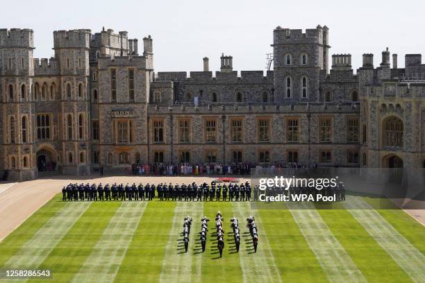 Royal Marines and members of the band line up during a ceremony where King Charles III will present members of the Royal Navy with the Royal...