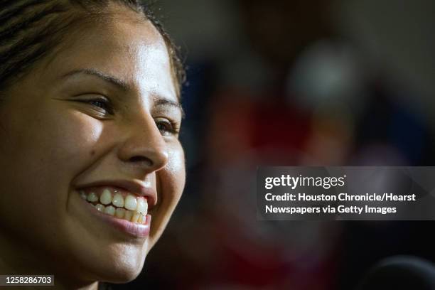 Boxer Marlen Esparza beams a smiley while doing a television interview after deferring Venezuela's Karlha Magliocco in a women's flyweight 51-kg...
