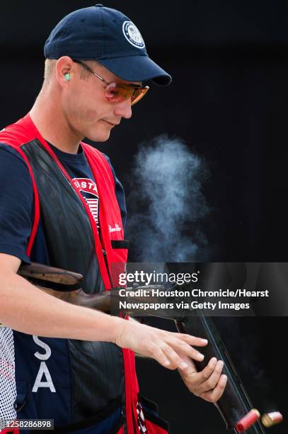 Glenn Eller ejects shells from his gun as he competes in the men's double trap qualification at the 2012 London Olympics on Thursday, Aug. 2, 2012.