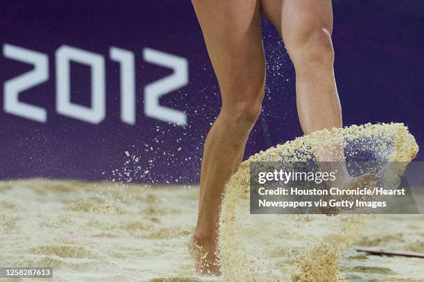 April Ross kicks up sand during the women's beach volleyball gold medal match at the 2012 London Olympics on Wednesday, Aug. 8, 2012.