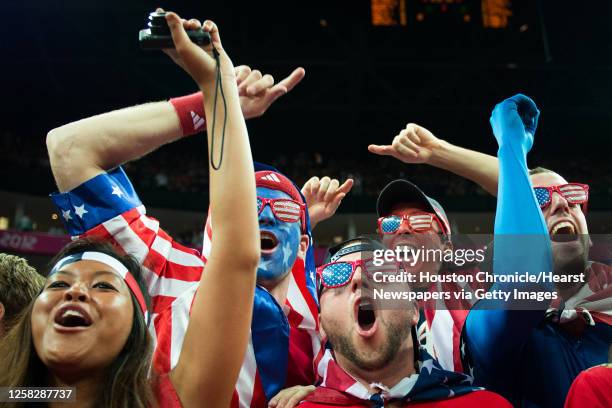 Fans cheer as their team takes the court to face Spain in the men's basketball gold medal match at the 2012 Summer Olympics on Sunday, Aug. 12 in...