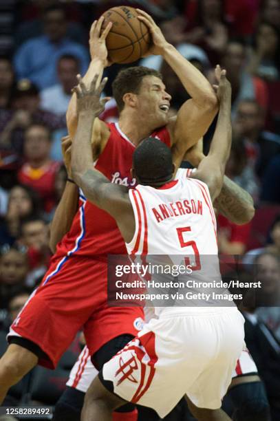 Los Angeles Clippers power forward Blake Griffin is tied up by Houston Rockets shooting guard James Anderson and power forward Greg Smith during the...