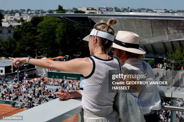 Spectators gesture on day three of the Roland-Garros Open tennis tournament in Paris on May 30, 2023.