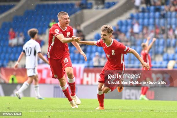 Karol Borys of Poland celebrates with teammate Igor Brzyski, left, after scoring their side's second goal during the UEFA European Under-17...