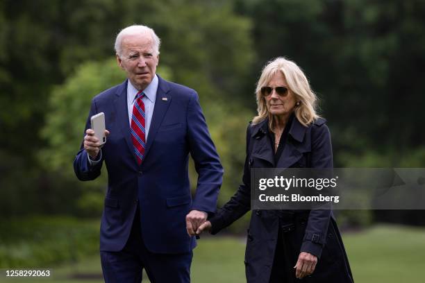 President Joe Biden and First Lady Jill Biden, right, walk on the South Lawn of the White House after arriving on Marine One in Washington, DC, US,...