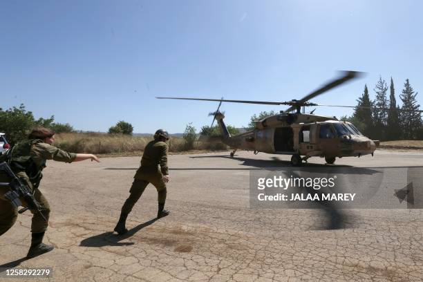 Israeli soldiers take part in the annual general military exercise 'Firm Hand' in the northern Kibbutz of Yiftah near the border with Lebanon on May...
