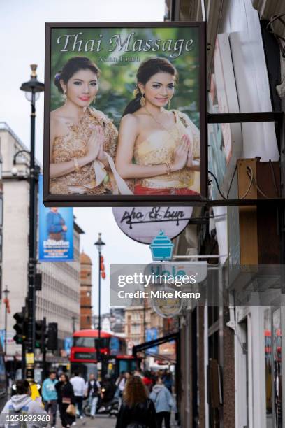 Sign for Thai massage on Shaftesbury Avenue on 22nd May 2023 in London, United Kingdom. Thai massage techniques combines compression, acupressure,...