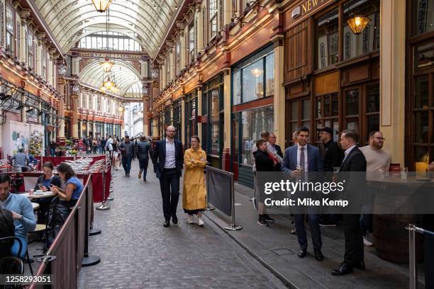 City workers enjoying a drink at Leadenhall Market in the City of London on 25th May 2023 in London, United Kingdom. Located in Gracechurch Street,...