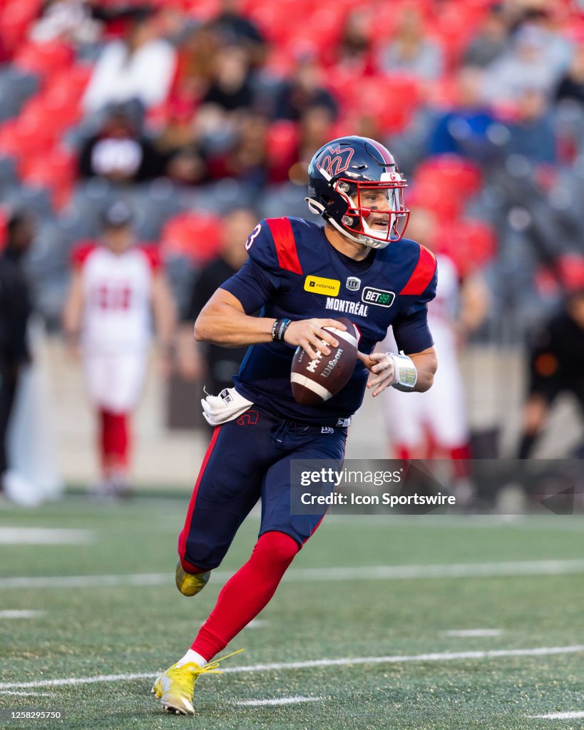 Davis Alexander Montreal Alouettes quarterback Davis Alexander runs with the ball ...