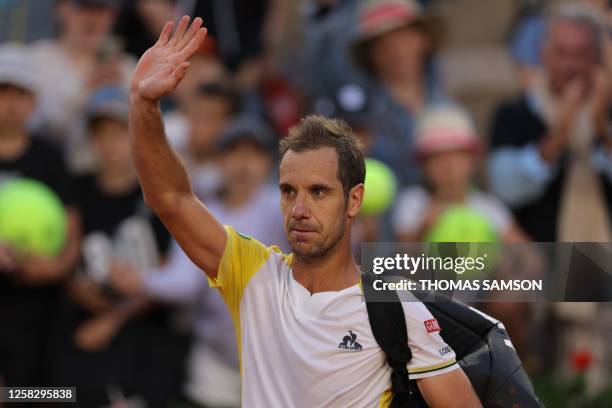 France's Richard Gasquet waves after being defeated by France's Arthur Rinderknech during their men's singles match on day three of the Roland-Garros...