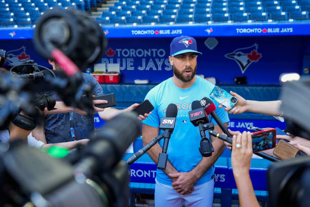 Anthony Bass of the Toronto Blue Jays makes a statement to the media before playing the Milwaukee Brewers in their MLB game at the Rogers Centre on...