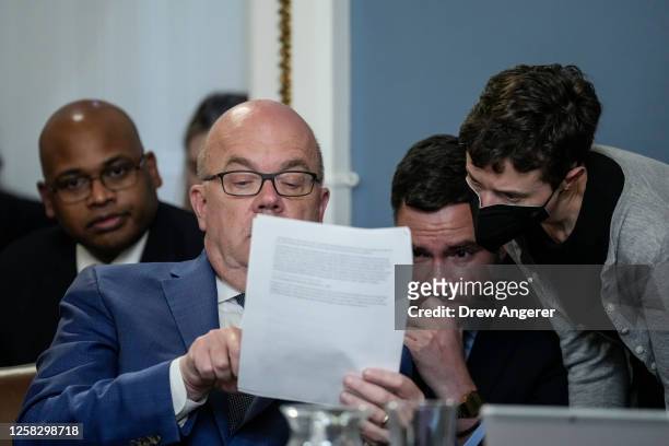 Committee ranking member Rep. Jim McGovern looks over notes with staff during a meeting of the House Rules Committee to consider H.R. 3746 - Fiscal...