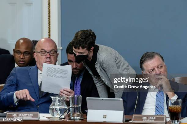 Committee ranking member Rep. Jim McGovern looks over notes with staff as committee chairman Rep. Tom Cole listens during a meeting of the House...