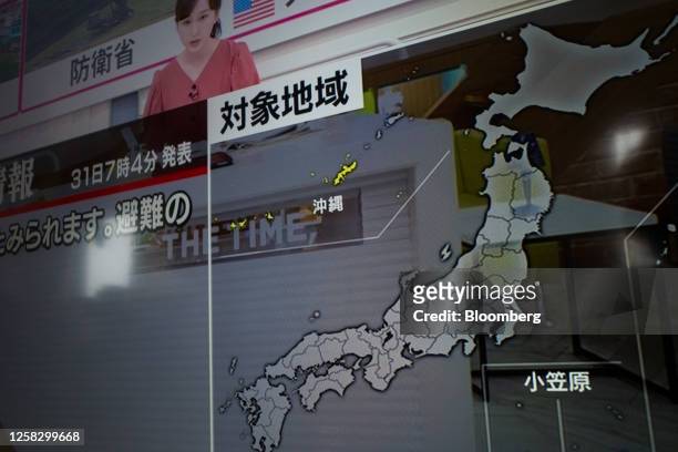 Television screen shows a Japanese map, after North Korea has fired a projectile the country claims to be a space launch vehicle, in Okinawa, Japan,...
