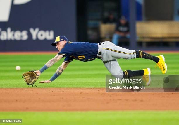 Pat Murphy of the Milwaukee Brewers drives for a ball against the Toronto Blue Jays in the seventh inning during their MLB game at the Rogers Centre...