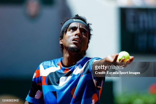 Elias Ymer of Sweden serves the ball against Casper Ruud of Norway during their Singles First Round Match on Day Three of the 2023 French Open at...