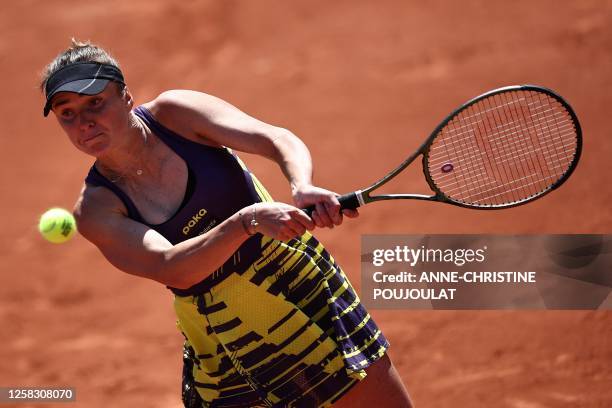 Ukraine's Elina Svitolina plays a backhand return to Australia's Storm Hunter during their women's singles match on day four of the Roland-Garros...