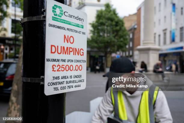 Camden council environment department No Dumping sign at Seven Dials in Covent Garden to disuade local businesses from leaving rubbish or they may...