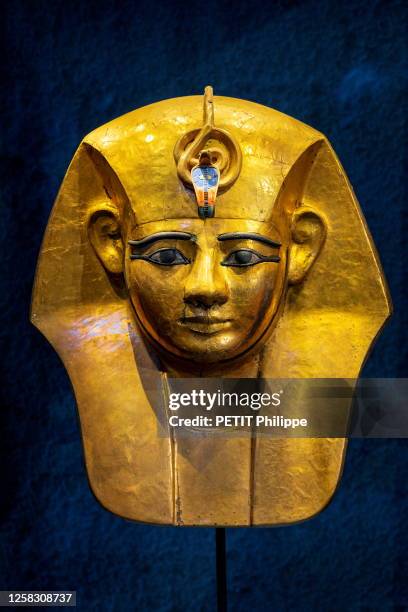 Paris, France at the exhibition "Ramses and the Gold of the Pharaohs" at the Grande Halle de La Villette, here, Mask in gold-plated wood, bronze,...