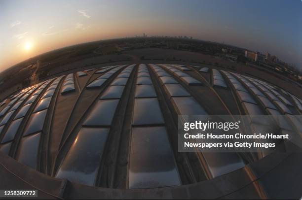 View of downtown Houston and a sunset shot from the top of the Astrodome, with a fish-eye lens. HOUCHRON CAPTION : A view of downtown Houston from...