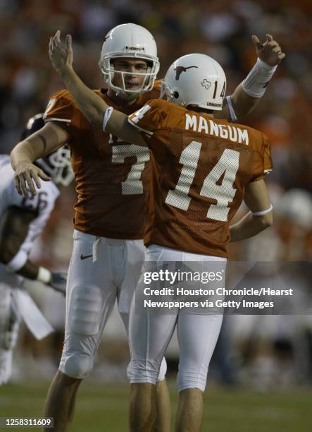 Texas' kicker, Dusty Mangum hugs, Matt Nordgren after his extra point went through during the 4th quarter of the Texas v Texas A&M football game,...