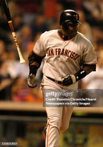 Barry Bonds flips his bat as he flied out to left on a bases loaded situation in the 8th inning , during the Houston Astros' baseball game against...