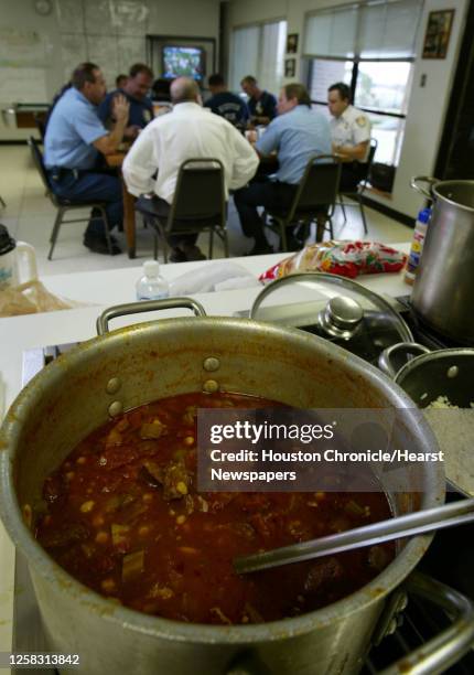 Pot of Gumbo with Okra sits on the stove as the crew of EMTs and firefighters eat dinner at Houston Fire Department's Station 21, after...