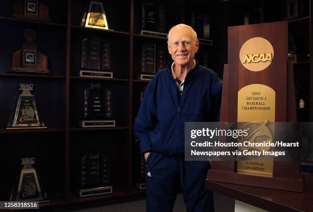 Rice coach Wayne Graham stands in the Rice baseball offices surrounded by a shelves full of trophies including the 2003 College World Series trophy,...