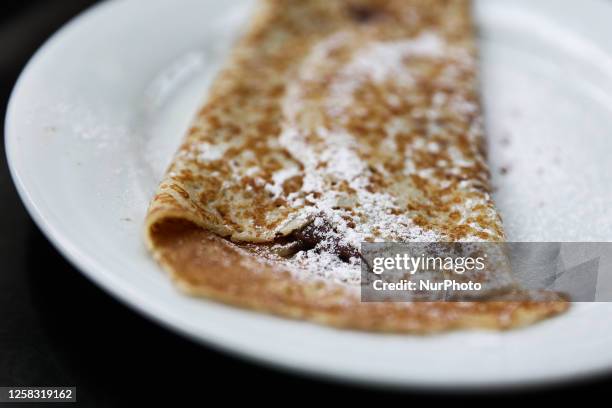 Crepe with Nutella is seen on a cafe table in this illustration photo taken in Nice, France on May 29, 2023.